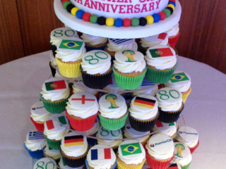 Corporate cake and iced cupcakes for 80th anniversary of Premier Oil